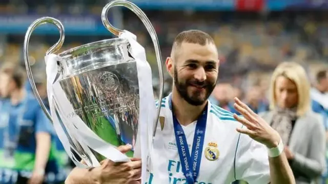 Karim Benzema stats in the UEFA Champions League, Benzema in a Real Madrid jersey. | Sportz Point