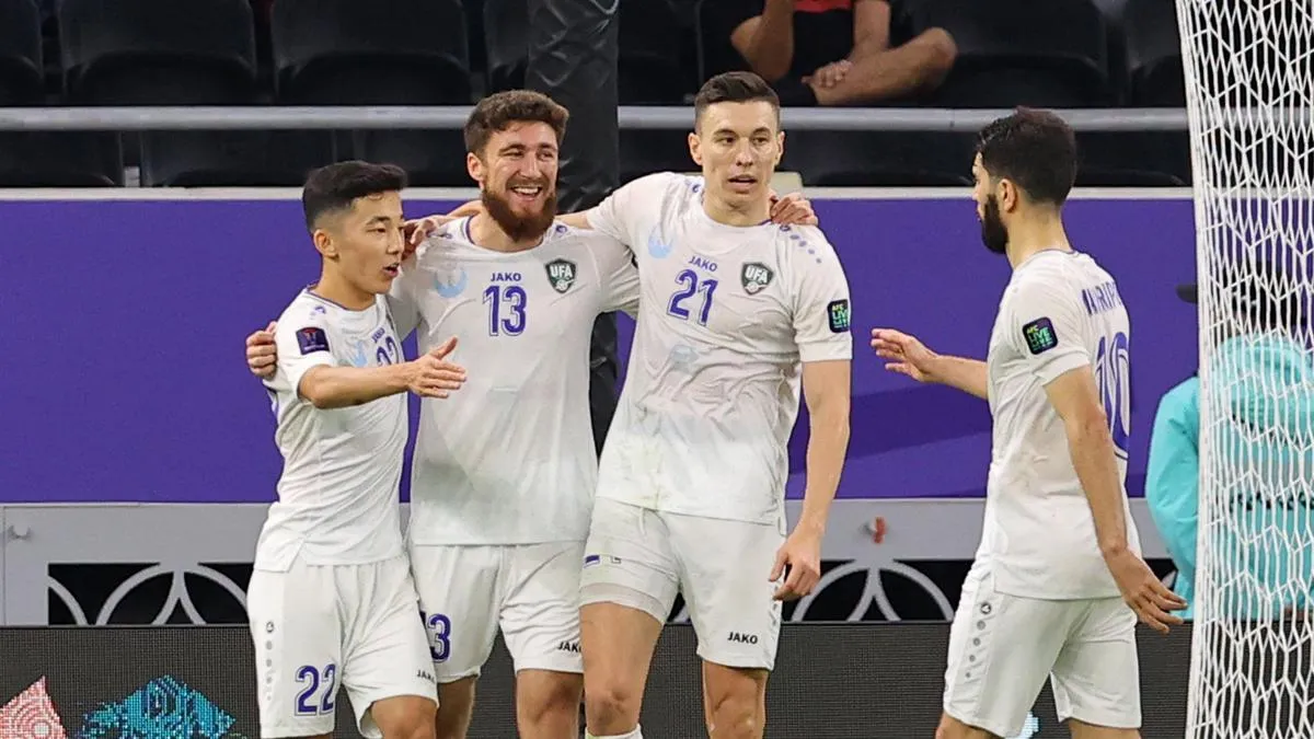 Uzbekistan players celebrating their goal against India in the AFC Asian Cup 2023 in Qatar.  