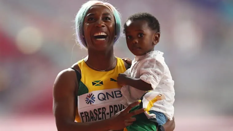 Mother's Day 2024 | Women In Sports: Female Athletes and Motherhood: Shelly-Ann Fraser-Pryce with her son Zyon after her 100m triumph at the 2019 IAAF World Championships in Doha