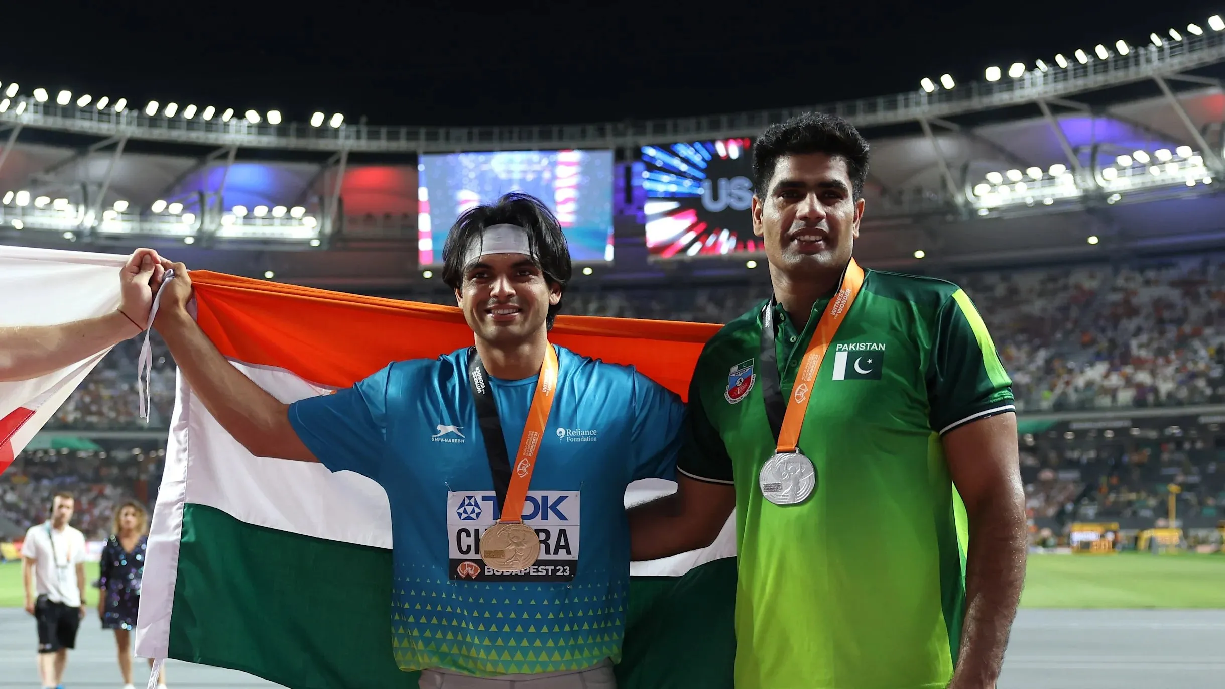 Gold medalist Neeraj Chopra, of India, and silver medalist Arshad Nadeem, of Pakistan, right, pose after finishing the Men's javelin throw final during the World Athletics Championships in Budapest, Hungary, Sunday, Aug. 27, 2023.   Image | AP Photo/Matthias Schrader