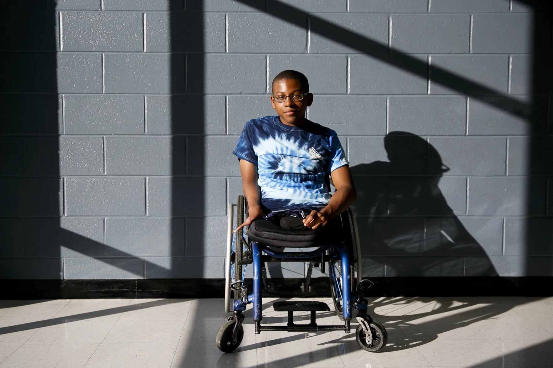Adonis Lattimore, a teen from Virginia born without legs wins the state