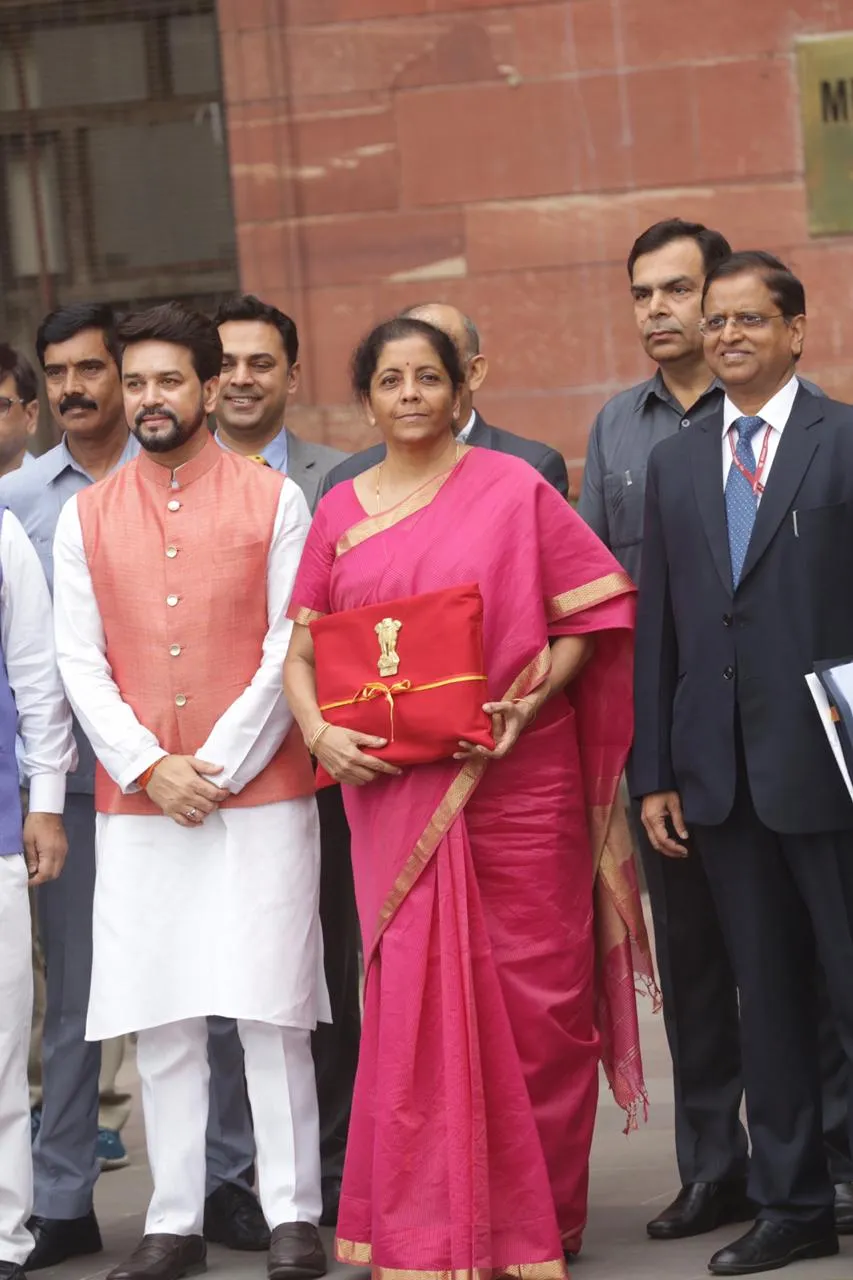 Union Minister for Finance Nirmala Sitharaman, MOS Anurag Thakur leave the Finance Ministry to present the Budget in parliament in New Delhi on Friday. Express Photograph by Neeraj Priyadarshi