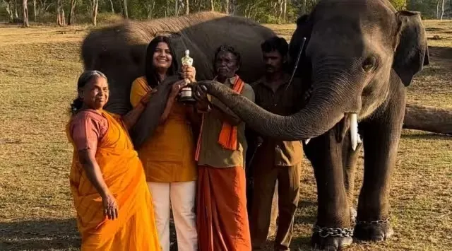 Kartiki Gonsalves with mahout Bomman, his wife Bellie, and baby elephants Raghu and Ammu of The Elephant Whisperers. (Photo: Kartiki Gonsalves/Instagram)