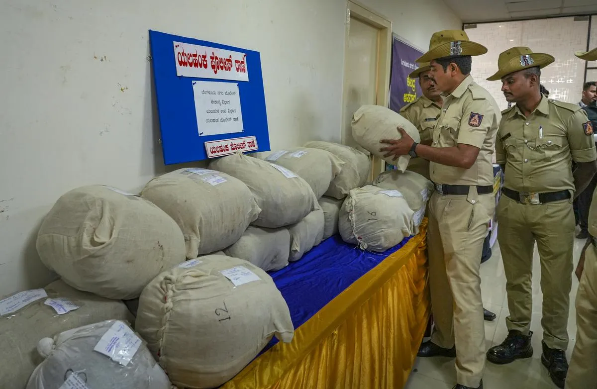 Policemen arranging seized sacks of narcotics before a press conference in Bengaluru on Tuesday.