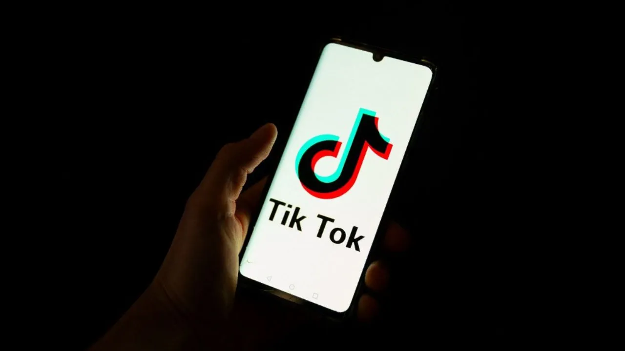 Representative photo of a man holding a smartphone displaying the logo of Chinese social media platform Tiktok. Photograph: (AFP) 