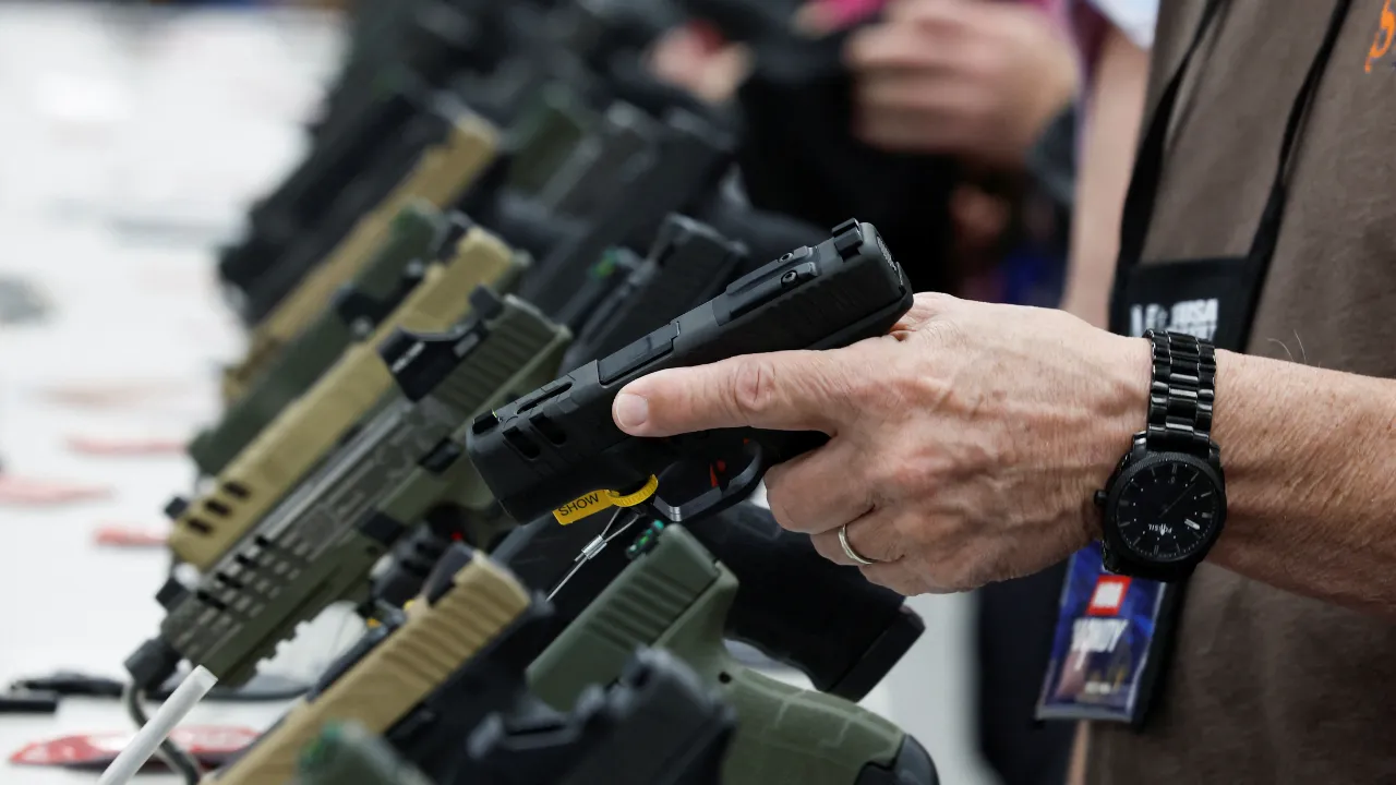  A person tries out a handgun during the National Rifle Association (NRA) annual convention in Indianapolis, Indiana, U.S., April 15, 2023. Photograph: (Reuters) 