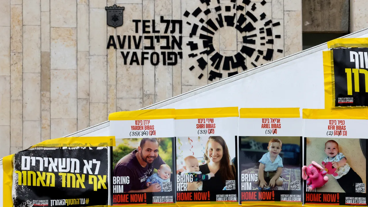  Posters of Shiri Bibas and her two young sons, Kfir and Ariel are plastered outside the Tel Aviv Museum of Art, now informally called the "Hostages Square", on February 19, 2025 Photograph: (AFP) 