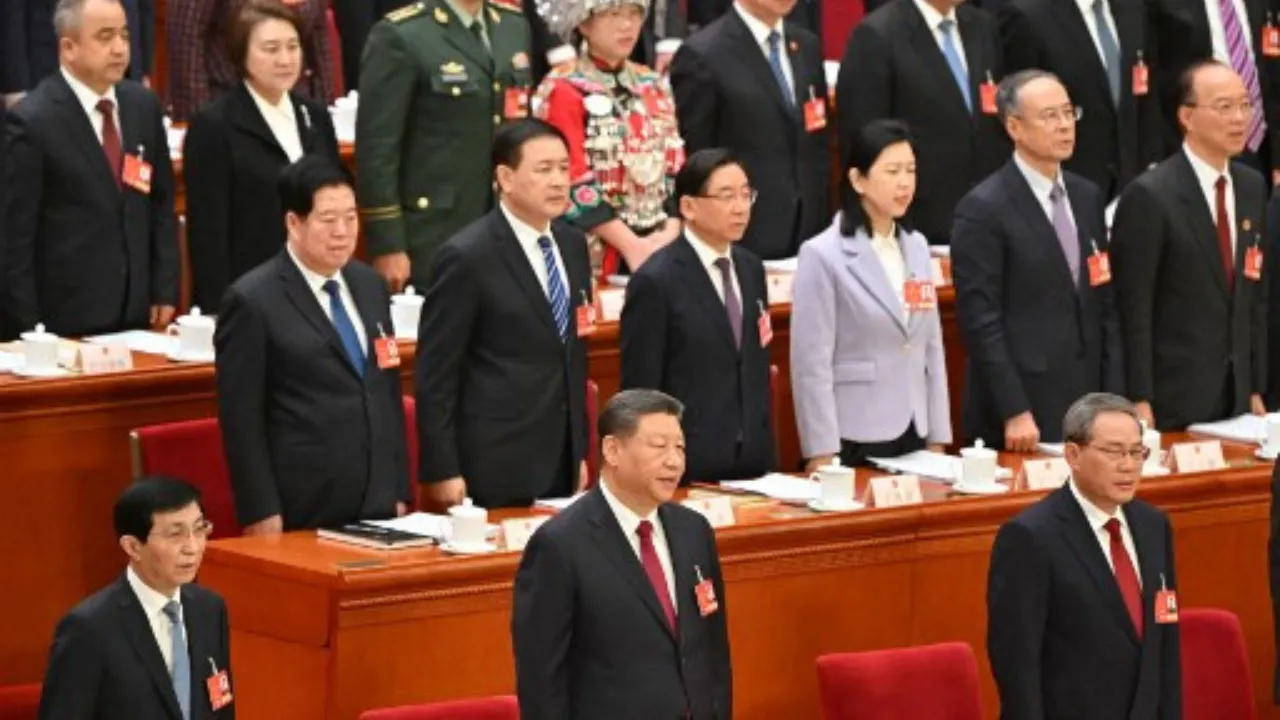  China's President Xi Jinping (C) sings the national anthem during the opening session of the National People's Congress (NPC) at the Great Hall of the People in Beijing on March 5, 2025. Photograph: (AFP) 