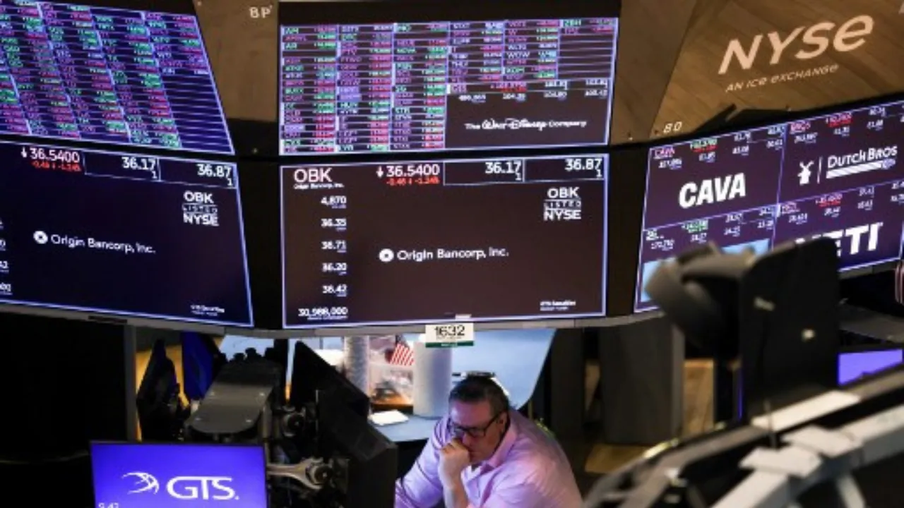  A trader works on the floor of the New York Stock Exchange (NYSE) at the opening bell in New York City on March 10, 2025. Photograph: (AFP) 