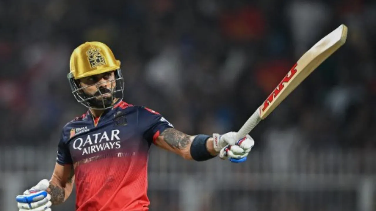  Virat Kohli celebrates after scoring half-century Photograph: (AFP) 