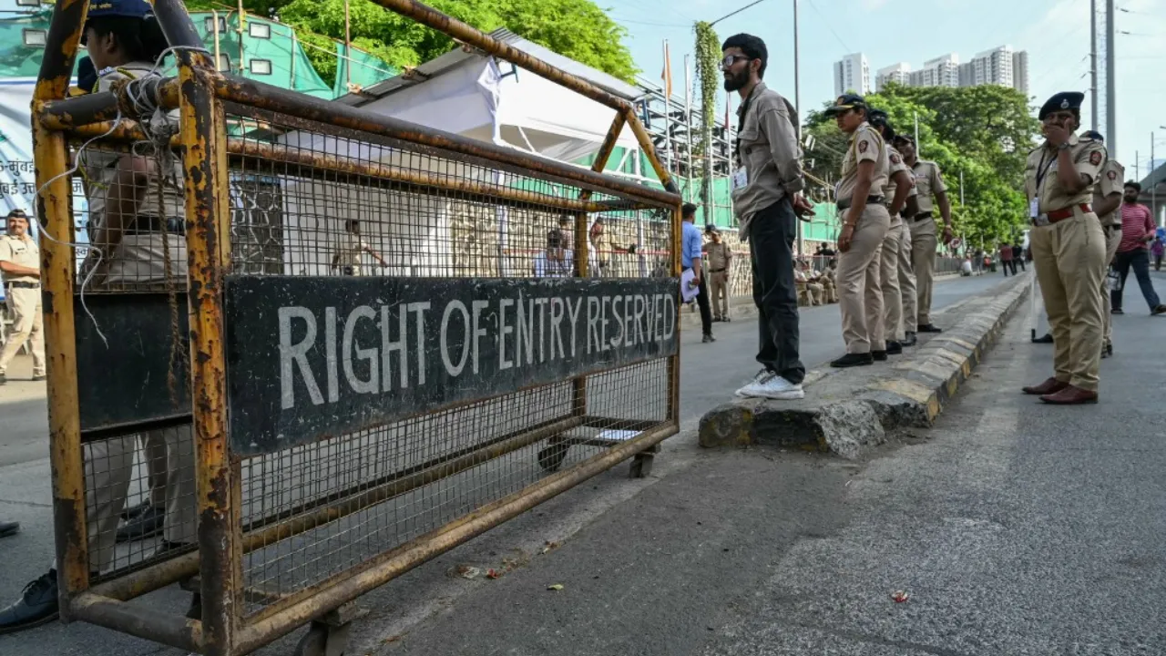  File Photo: Police personnel stand guard at an election vote counting centre in Mumbai on June 4, 2024. Photograph: (AFP) 