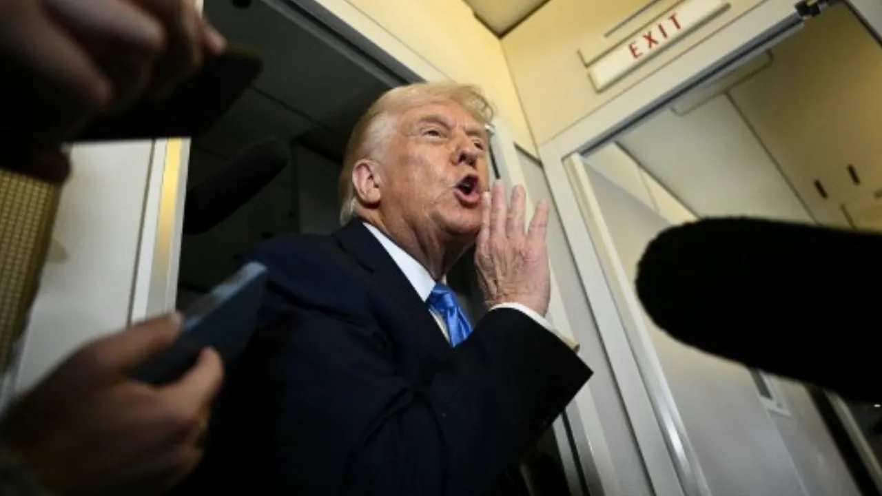  US President Donald Trump speaks to the press aboard Air Force One before arriving at Palm Beach International Airport in West Palm Beach, Florida, on March 28, 2025. Photograph: (AFP) 