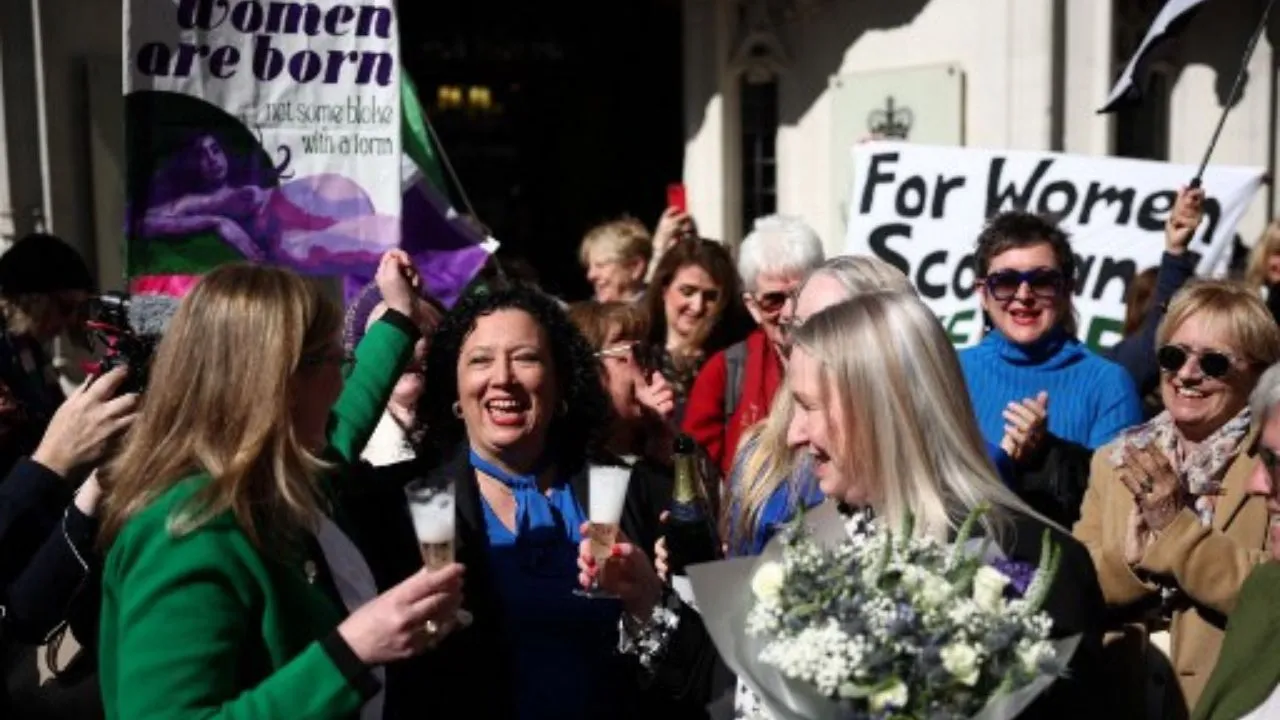 Susan Smith (L) and Marion Calder (3R), Directors of For Women Scotland, celebrate with Maya Forstater of 'Sex Matters' outside Britain's Supreme Court in London on April 16, 2025, following the court's ruling on how to define a 'woman'.