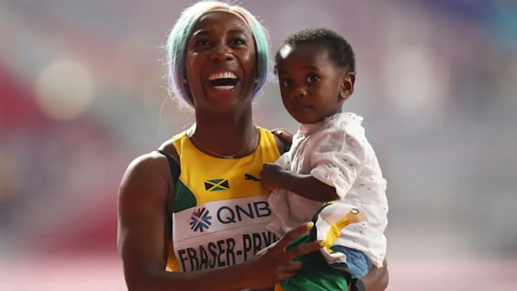 Mother's Day 2024 | Women In Sports: Female Athletes and Motherhood: Shelly-Ann Fraser-Pryce with her son Zyon after her 100m triumph at the 2019 IAAF World Championships in Doha