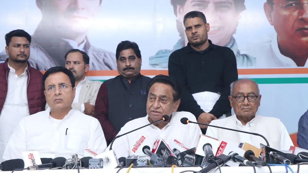 Randeep Singh Surjewala, Kamal Nath and Digvijaya Singh addressing a press conference after the election results on Sunday in Bhopal