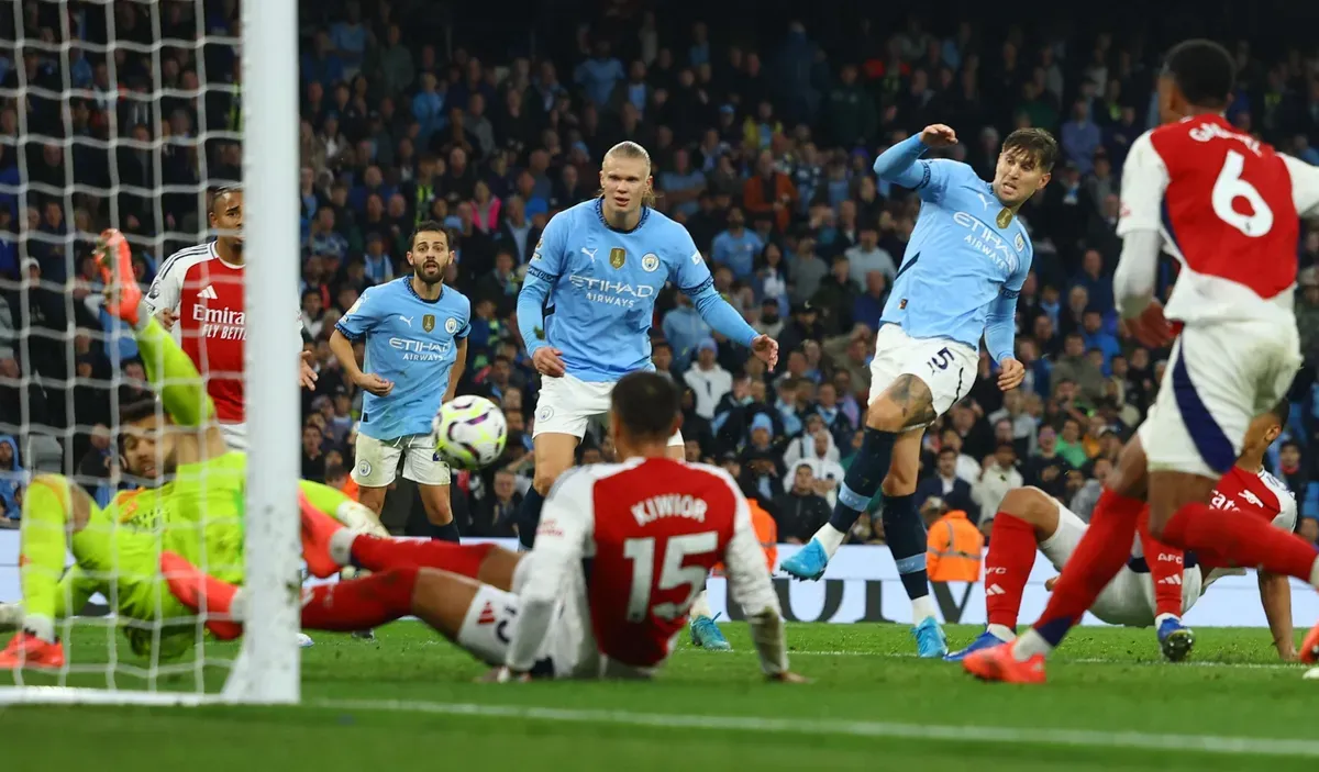 John Stones scored a late equaliser for Manchester City against Arsenal - sportzpoint.com