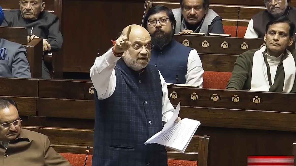 Amit Shah speaks in the Rajya Sabha during the Winter session of Parliament, in New Delhi, Monday, Dec. 11, 2023. 