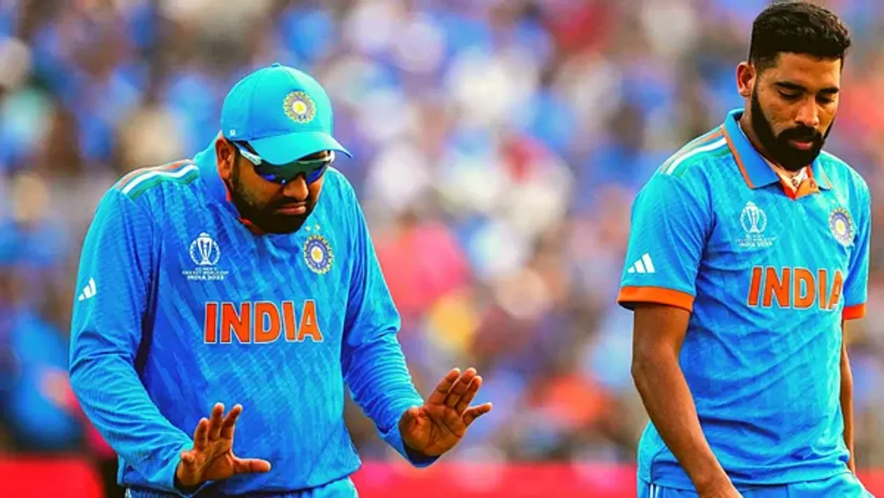 India's captain Rohit Sharma and Mohammed Siraj during the ICC Men's Cricket World Cup match between Bangladesh and India in Pune, India, Thursday, Oct. 19, 2023. (AP Photo)