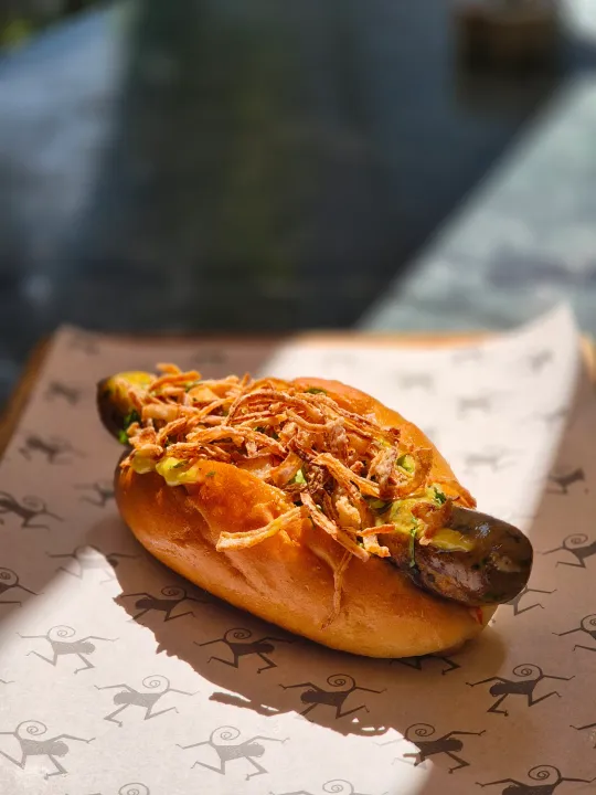 Dive into Deliciousness: Monkey Bar is partnering with Salty Cured Pigs to bring a limited edition menu of Hot Dawgs & Sandos!