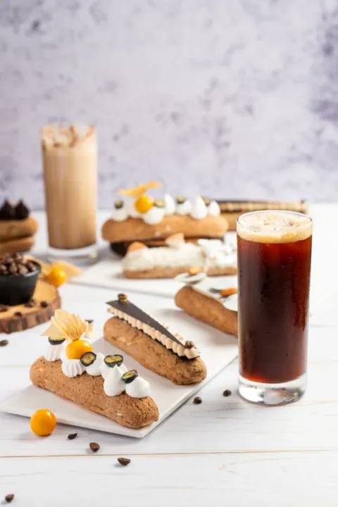 Treat your sweet temptations with a blissful combination of Eclairs and Cold Brews