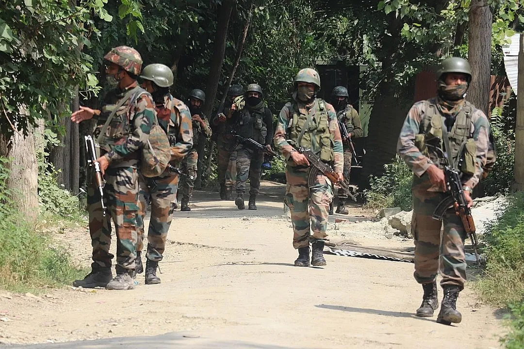  Srinagar: Army personnel conduct a cordon and search operation after two terrorists were killed in an encounter with the security forces at Ranbirgarh Panzinara on the outskirts of Srinagar on July 25, 2020. (Photo: IANS) 