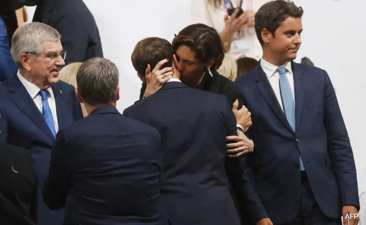  French President Macron's embrace and kiss with French Sports Minister