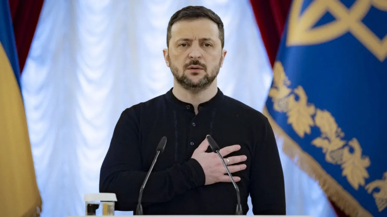  This handout picture taken and released by Ukrainian Presidential Press Service on December 26, 2024 shows Ukrainian President Volodymyr Zelensky (L) stands for the National anthem of Ukraine during an award ceremony in Kyiv, amid the Russian invasion in Ukraine. Photograph: (AFP) 