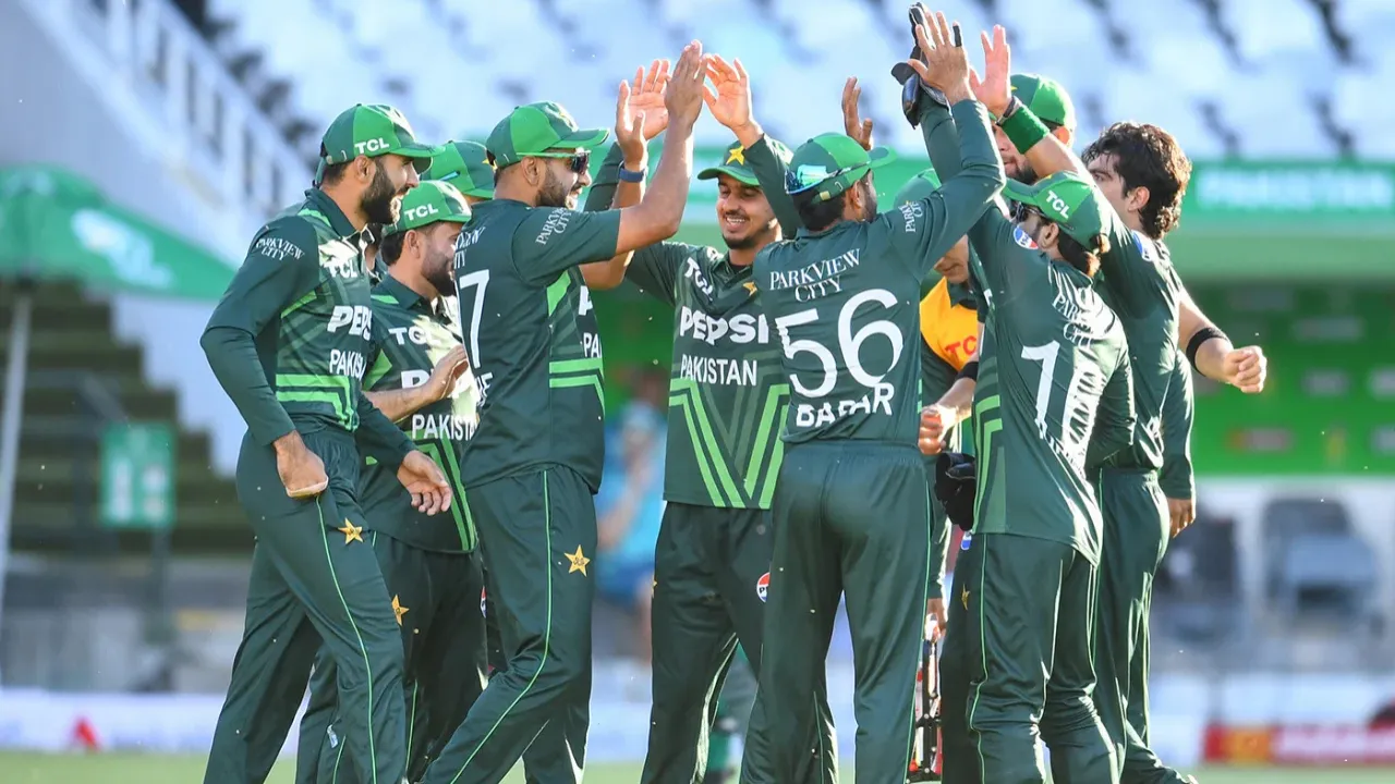  Pakistan players celebrate after taking a wicket Photograph: (AFP) 
