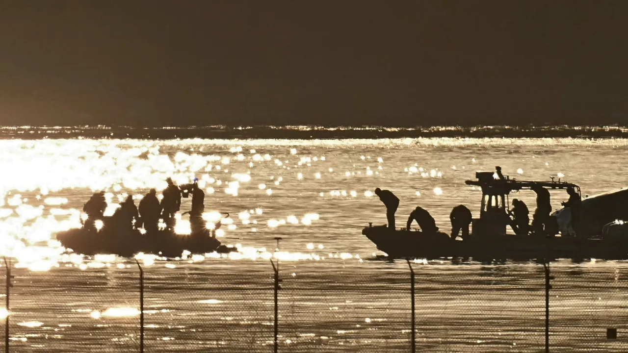  Part of the wreckage is seen as rescue crews search the waters of the Potomac River after American Airlines flight 5342 on approach to Reagan National Airport crashed into the river after colliding with a US Army helicopter, near Washington, DC. Photograph: (AFP) 