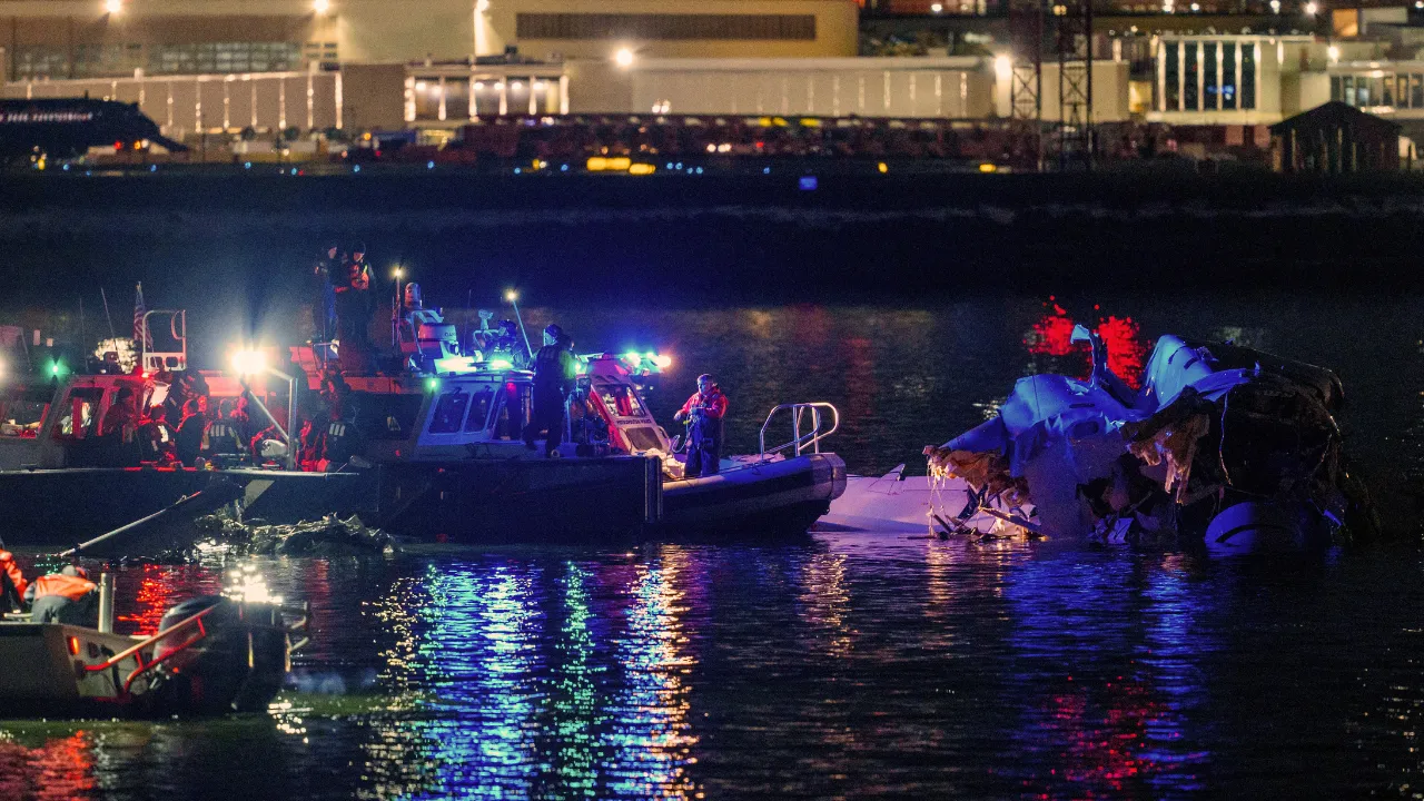  Emergency response teams including Washington, DC Fire and EMS, DC Police and others, assess airplane wreckage in the Potomac River Photograph: (AFP) 