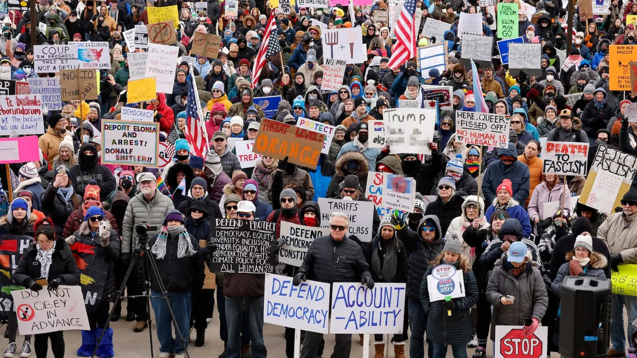  People protest against President Donald Trump and Elon Musk outside the Michigan Capitol in Lansing, Michigan Photograph: (AFP) 