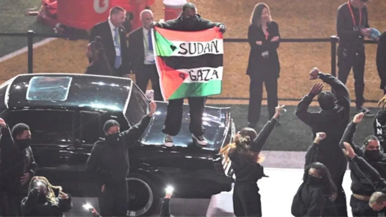  Palestinian flag-waving protester crashes Kendrick Lamar’s Super Bowl performance; tackled by security Photograph: (AFP) 
