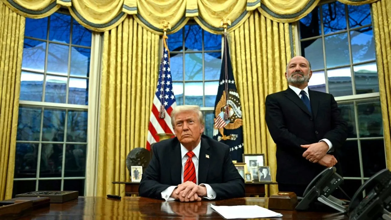  US President Donald Trump speaks to the press after signing an executive order, alongside US Secretary of Commerce nominee Howard Lutnick (R), in the Oval Office of the White House in Washington, DC, on February 10, 2025. Photograph: (AFP) 