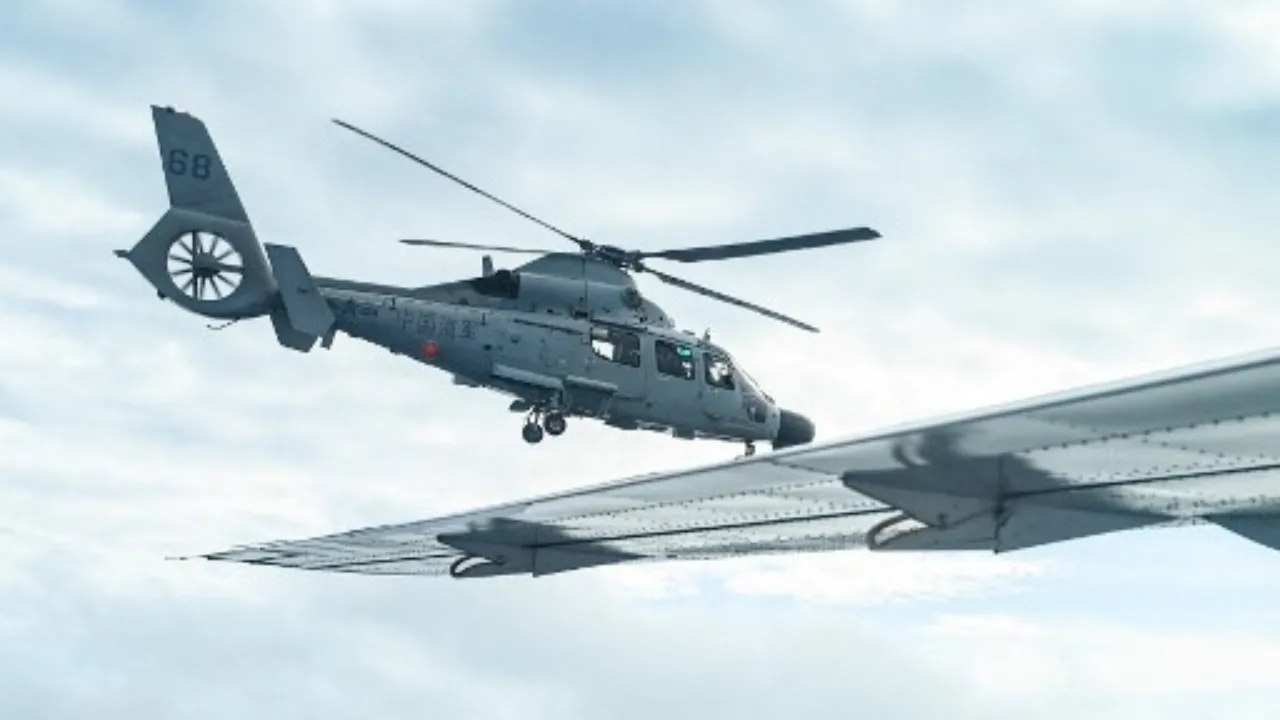  An aircraft identified by the Philippine Coast Guard as Chinese Navy helicopter (L) flies near the Bureau of Fisheries and Aquatic Resources (BFAR) plane during an aerial reconnaissance flight at Scarborough Shoal in the South China Sea on February 18, 2025. Photograph: (AFP) 