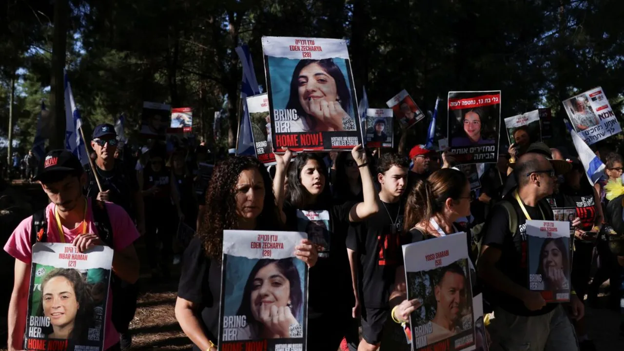  Family members, friends and supporters of Israelis and other nationalities who were taken hostage on October 7 after they began a march towards Jerusalem Photograph: (Reuters) 