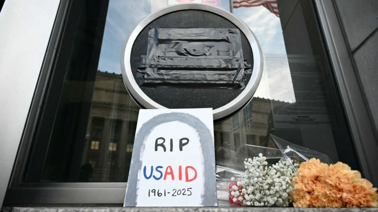  Tributes are placed beneath the covered seal of the US Agency for International Development (USAID) at their headquarters in Washington, DC, on February 7, 2025, after US President Donald Trump called for USAID to be shuttered. Photograph: (AFP) 