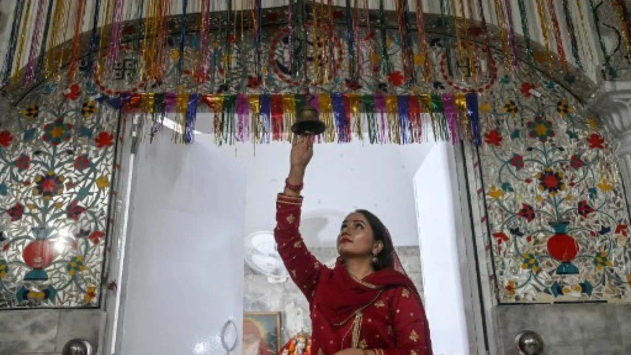  A Pakistani Hindu woman visits the Krishna Temple to celebrate 'Diwali', the festival of lights, in Lahore on November 1, 2024. Photograph: (AFP) 