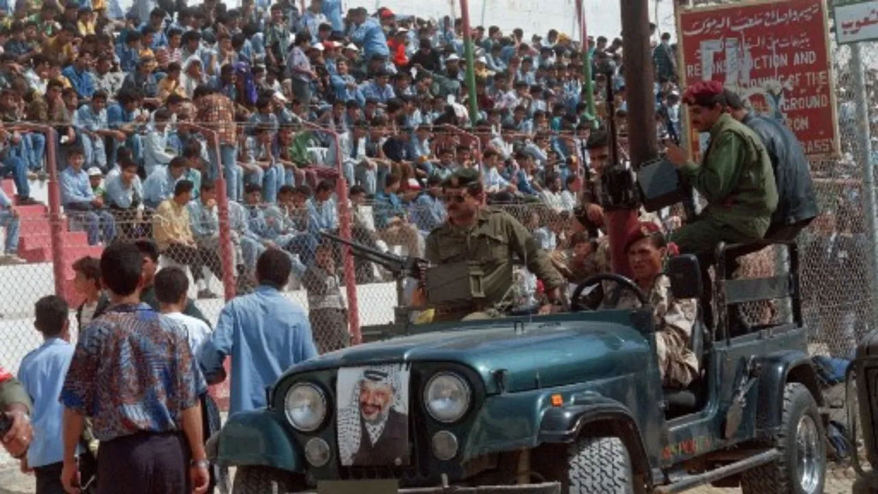  A Palestinian unit of PLO Leader Yasser Arafat guards "Force 17" controls the entrance of the crowd, on May 3, 1995 during a rally in Gaza City commemorating the first anniversary of the Palestinian police's entry into Jericho and the Gaza Strip. Photograph: (AFP) 