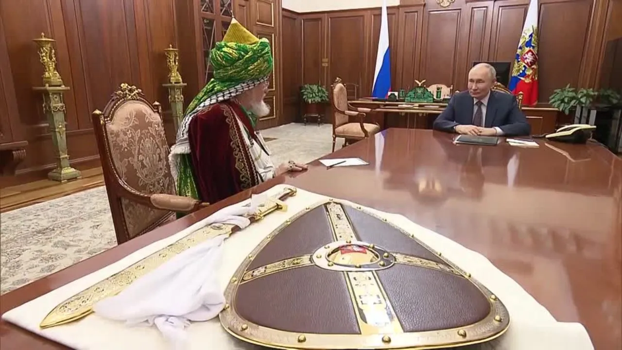  Grand Mufti Talgat Tadzhuddin presents a sword and a shield to Russian President Vladimir Putin on Monday (Feb 24). Photograph: (Reuters) 