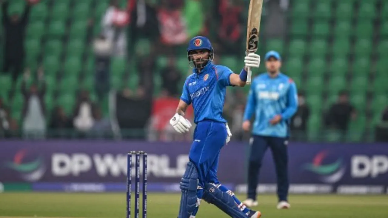  Ibrahim Zadran celebrates after scoring century Photograph: (AFP) 