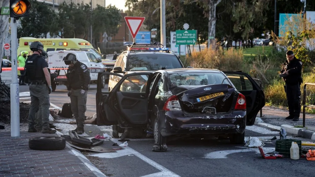  Israeli security forces inspect a vehicle that reportedly rammed into pedestrians at the Karkur junction south of the city of Haifa in northern Israel on February 27, 2025 Photograph: (AFP) 