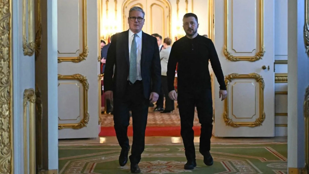  Britain's Prime Minister Keir Starmer (L) and Ukraine's President Volodymyr Zelensky (R) head to a private room to hold a meeting during a summit at Lancaster House in central London on March 2, 2025.  Photograph: (AFP) 
