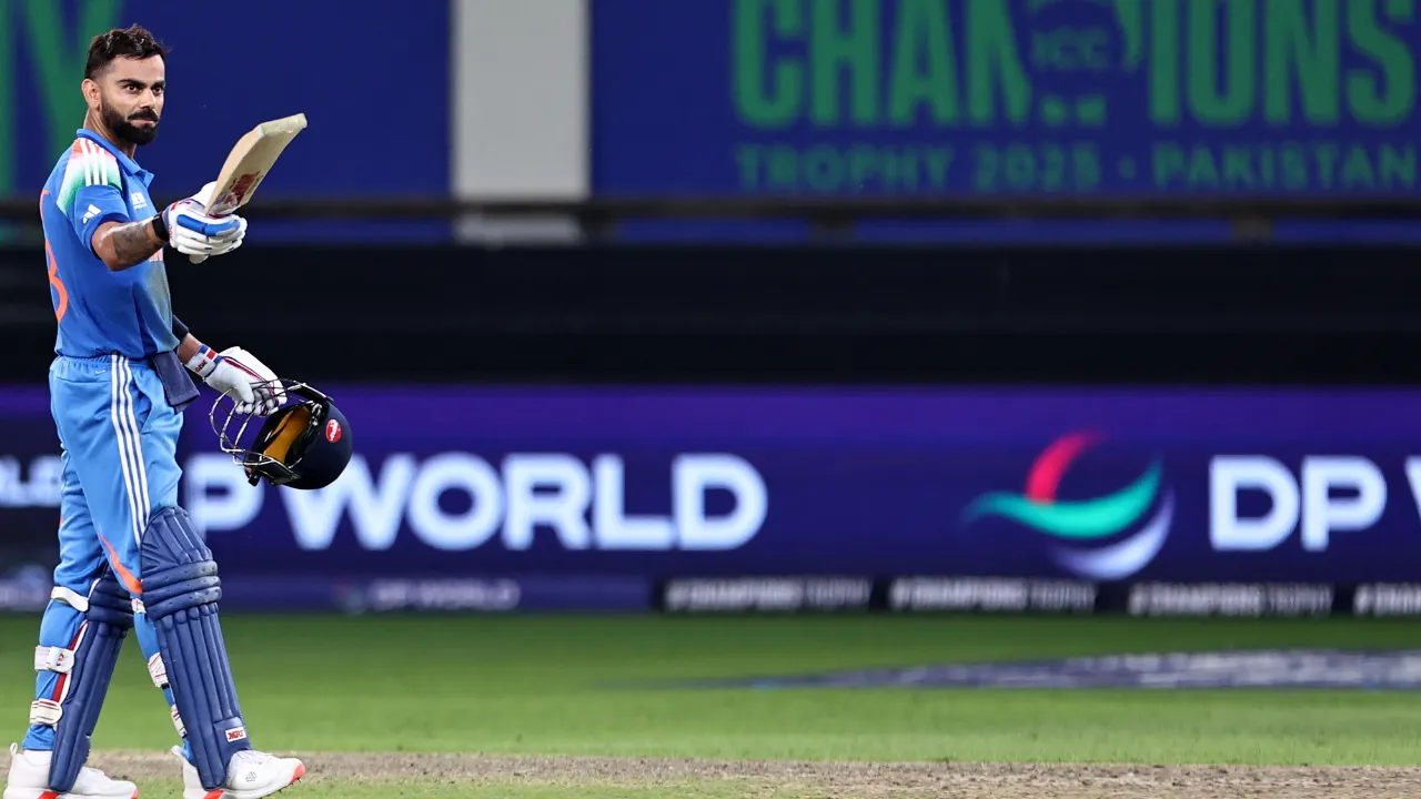  Virat Kohli celebrates his half-century against Australia  Photograph: (AFP) 