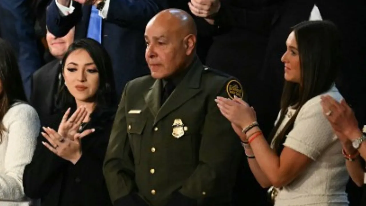  US Border Patrol agent Roberto Ortiz (2nd R) stands as he is recognized by US President Donald Trump during Trump's address to a joint session of Congress in the House Chamber of the US Capitol in Washington, DC, on March 4, 2025. Photograph: (AFP) 