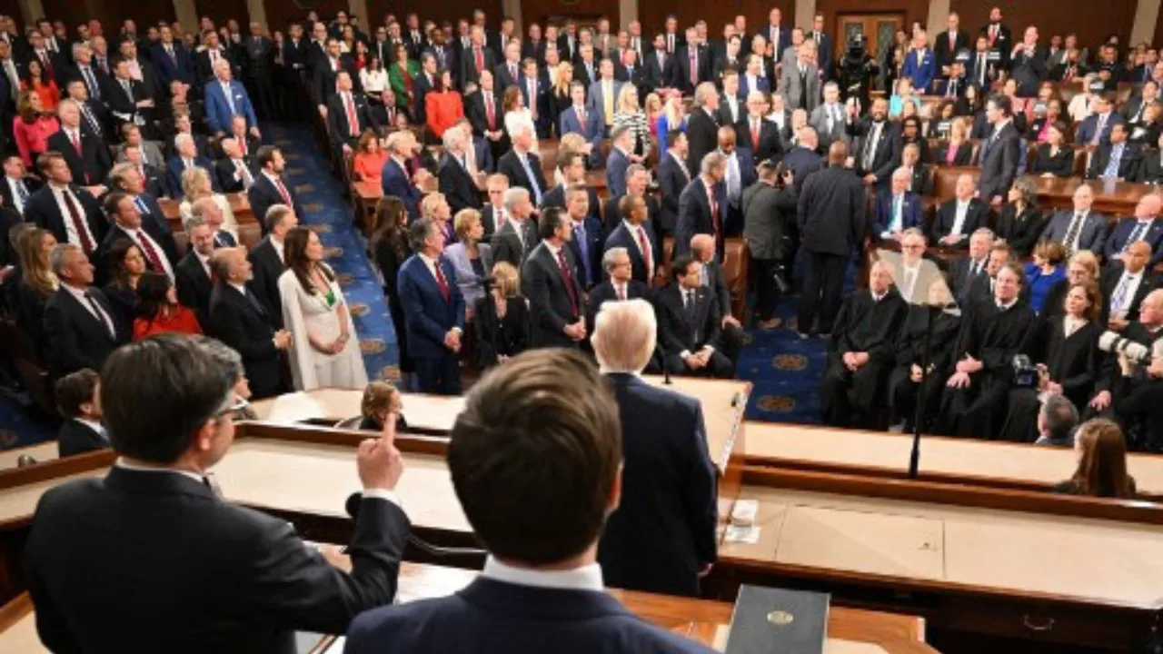  US Representative Al Green (D-TX) (back, C) shouts as US President Donald Trump delivers his address to a joint session of Congress, flanked by US Speaker of the House Mike Johnson (L) and Vice President JD Vance, at the US Capitol in Washington, DC, on March 4, 2025. Photograph: (AFP) 