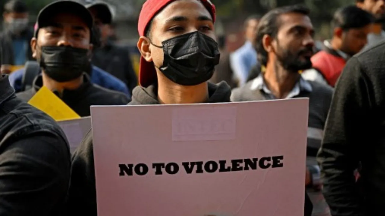  A demonstrator holds a placard during a sit-in protest in New Delhi on December 9, 2024, demanding restoration of peace in India's northeastern state of Manipur. Photograph: (AFP) 