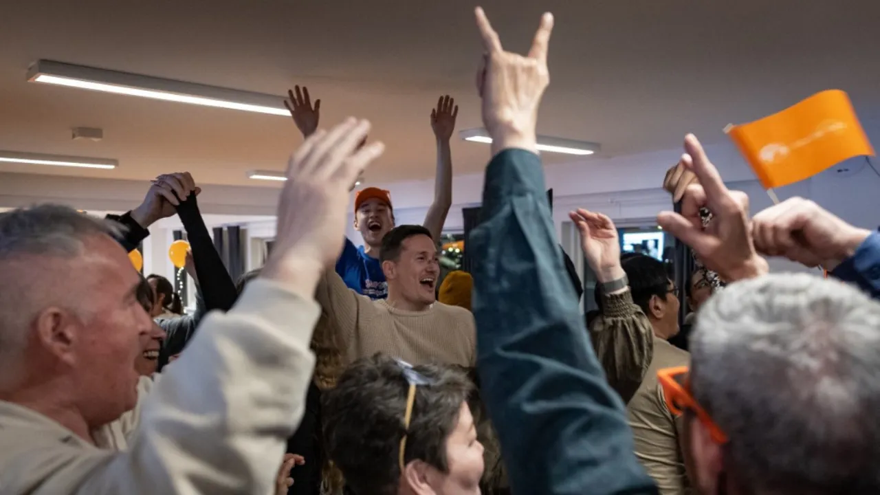  Candidate for the Greenlandic nationalist party Naleraq, Juno Berthelsen (C) and party members celebrate as the voting numbers come in, in Nuuk on March 11, 2025. On March 11 Greenland voted in legislative elections that could yield a timeline for independence for the Danish self-governing territory coveted by US President Donald Trump. Photograph: (AFP) 