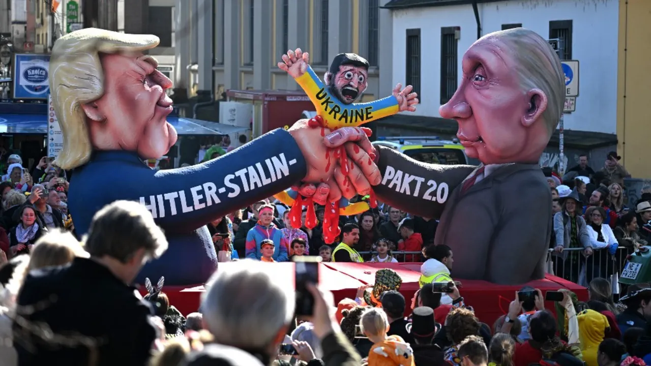 A float portraying Russian President Vladimir Putin (R) and US President Donald Trump (L) forming a 'Hitler - Stalin - Pact 2.0' to squash Ukraine and its President Zelensky is pictured during the parade to celebrate Rose Monday (Rosenmontag) in Duesseldorf, western Germany on March 3, 2025. Photograph: (AFP) 