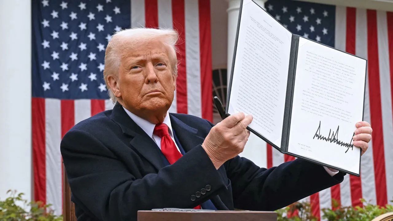  US President Donald Trump holds a signed executive order after delivering remarks on reciprocal tariffs during an event in the Rose Garden entitled "Make America Wealthy Again" at the White House in Washington, DC, on April 2, 2025. Photograph: (AFP) 