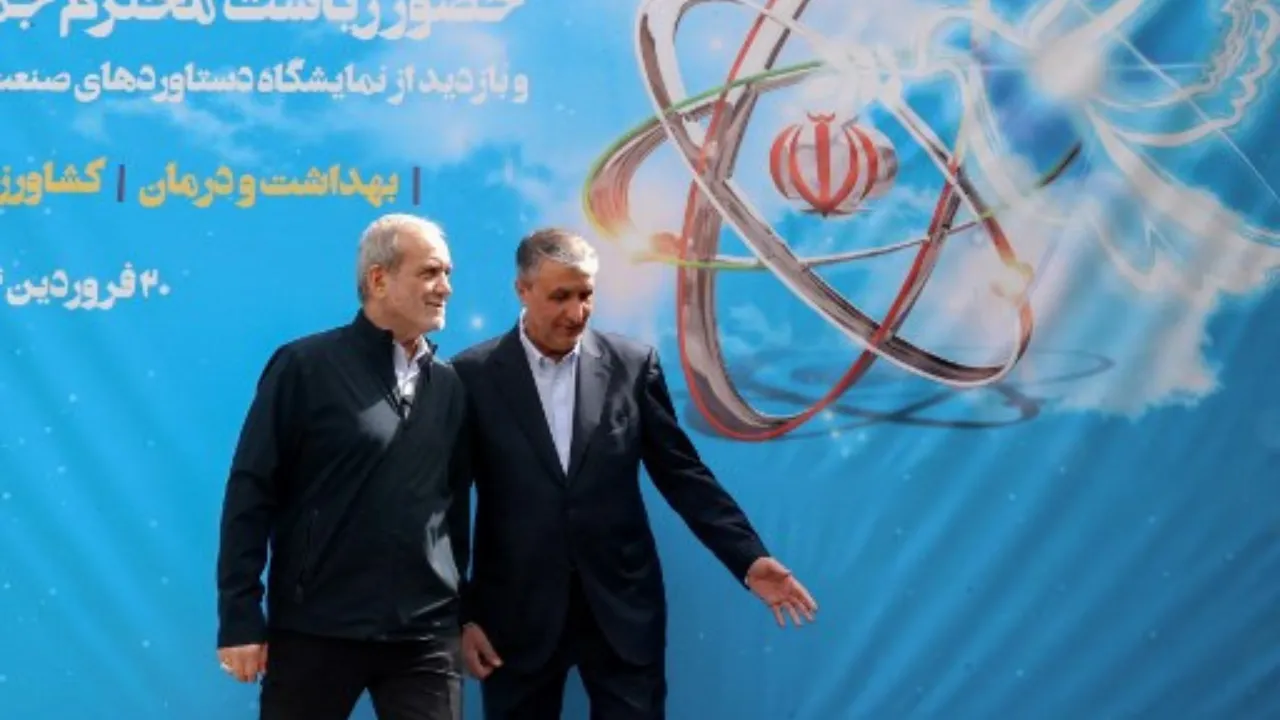 A handout picture provided by the Iranian presidency shows President Masoud Pezeshkian (L) and the Atomic Energy Organisation of Iran (AEOI) chief Mohammad Eslami (R) during the "National Day of Nuclear Technology", in Tehran, on April 9, 2025. Photograph: (AFP) 